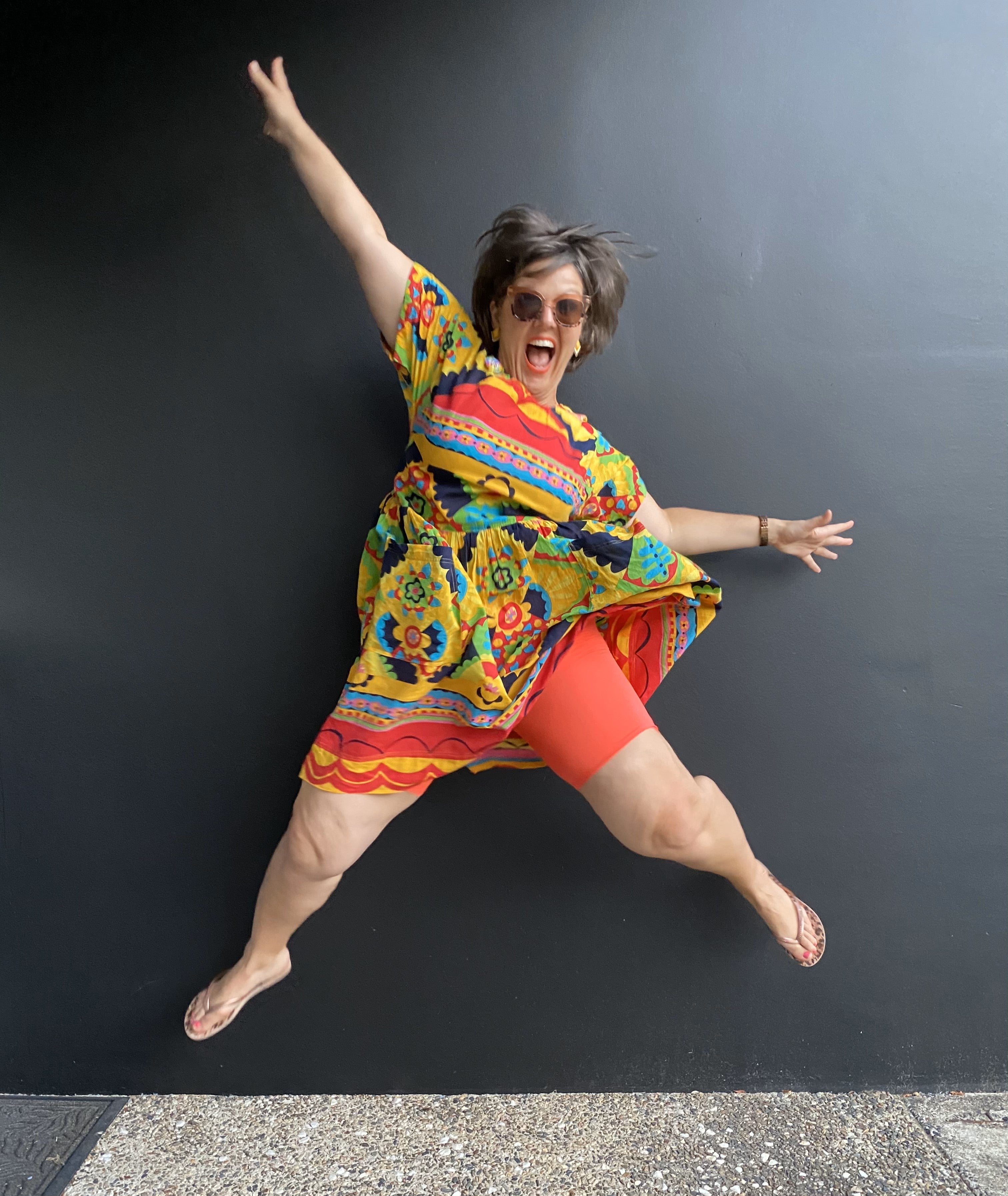 Hayley wearing Tangerine Dream Skanties jumping in the air with joy. the fun can be seen in her face with a big smile of confidence.